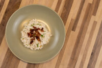 Halušky with Bryndza, Overhead Halušky with Bryndza, small dumplings in white cheese sauce topped with crisp bacon and parsley.