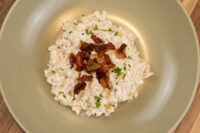 Halušky with Bryndza Cheese Substitution Bowl of Halušky with Bryndza Cheese Substitution topped with crispy bacon and herbs