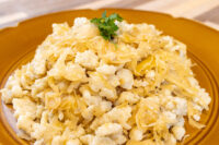 Halušky with Sauerkraut Plate of Halušky with Sauerkraut, garnished with a sprig of parsley.