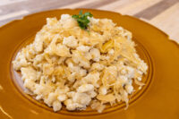 Halušky with Sauerkraut Plate of Halušky with Sauerkraut, crumbled potato dumplings tossed with golden sauerkraut strands, parsley on top.