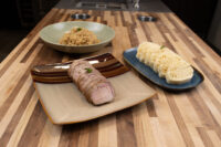 Sliced pork, sauerkraut, and sliced dumplings plated for Pork-Sauerkraut-Dumpling (Vepřo-knedlo-zelo)