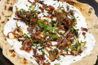 Lokše Flat Bread with Bryndza Cheese Substitute and Bacon Lokše Flat Bread with Bryndza Cheese Substitute and Bacon, topped with crispy onions, bacon, and chives.