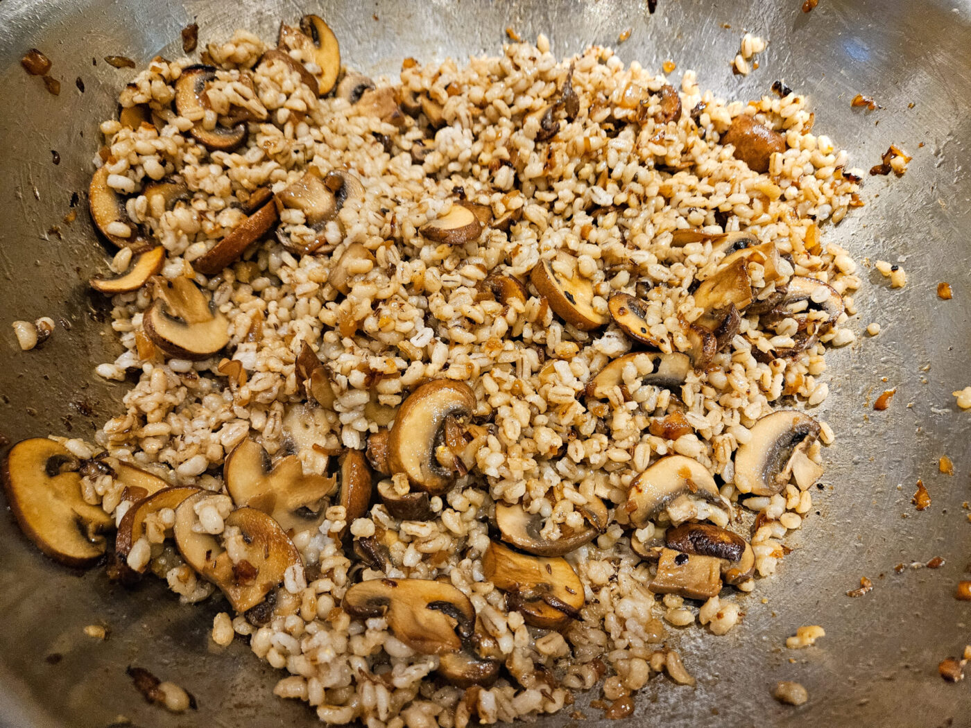 Mushroom KubPearl barley where added to the onion to mushroom to be sauted for Mushroom Kuba (Houbovy Kuba)a - steps-06