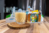 Czech Egg Liqueur – Czech Eggnog A glass of Czech Egg Liqueur – Czech Eggnog on a wood slice coaster with a Nativity paper cutout behind it