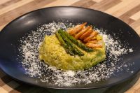 Asparagus Risotto with Shrimp Plated Asparagus Risotto with Shrimp topped with grilled asparagus and shrimp, dusted with parmesan.