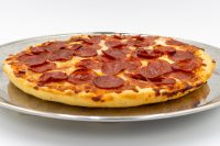 60 min. Pan Pizza A 60 min. Pan Pizza with a thick golden crust, melted cheese, and pepperoni, on a metal tray.