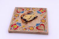 Sheet Kolach with Streusel Slice of Sheet Kolach with Streusel showing crumb topping and dark berry filling on a painted board.